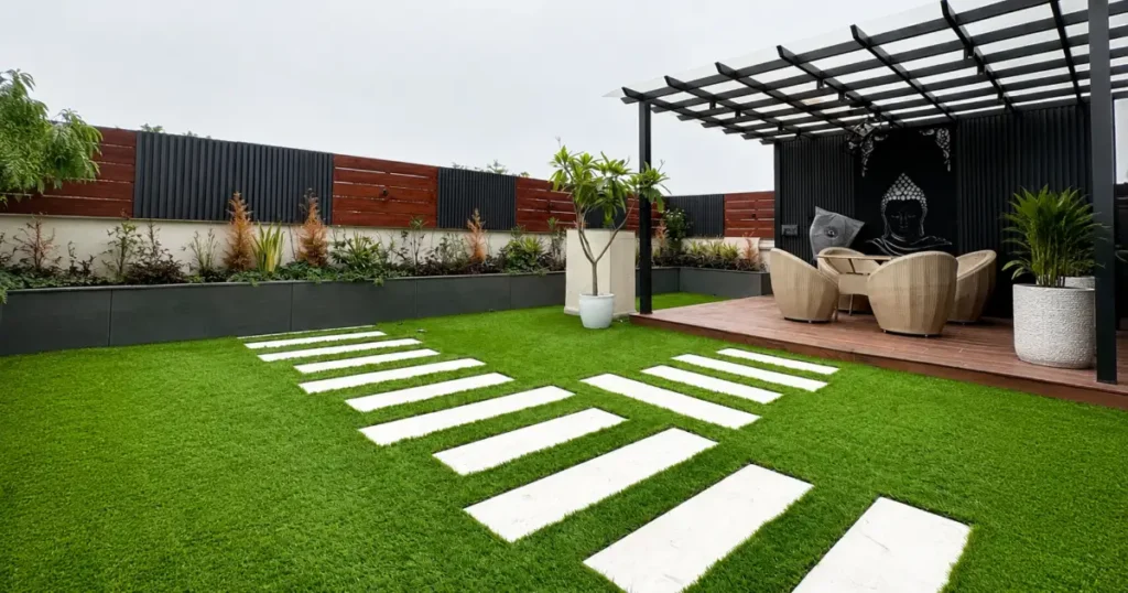 Modern terrace artificial grass with white paving stones